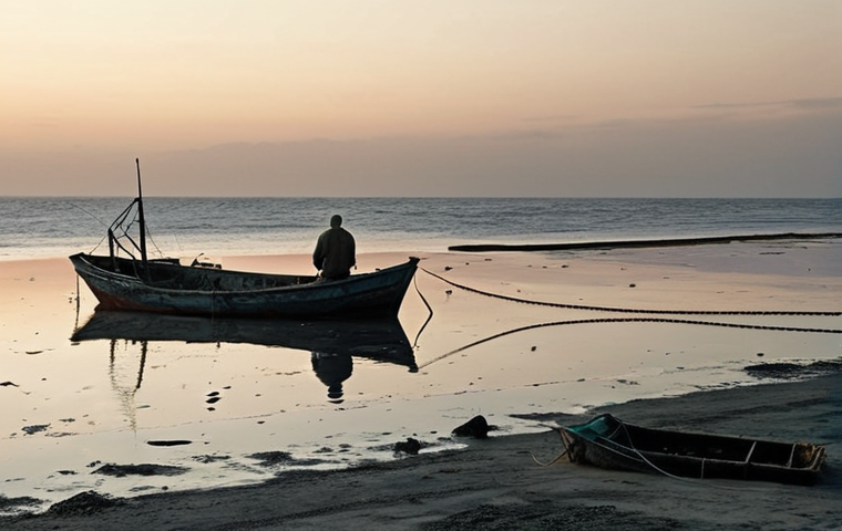 **Prompt:** A desolate ocean scene at dawn. A small, aged fishing boat with a single, weary fisherman. His empty nets hang loose, symbolizing depleted marine resources. In the background, a vast, once-bountiful fishing ground looks barren and lifeless. The overall mood is somber and reflective of overfishing's devastating impact. (Style: Realistic, cinematic, wide shot, muted colors).